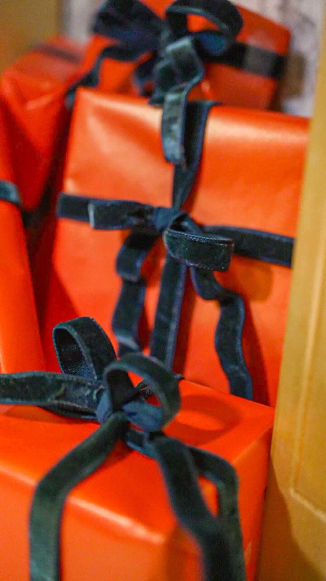 Carefully wrapped and organized décor pieces finished with velvet ribbon